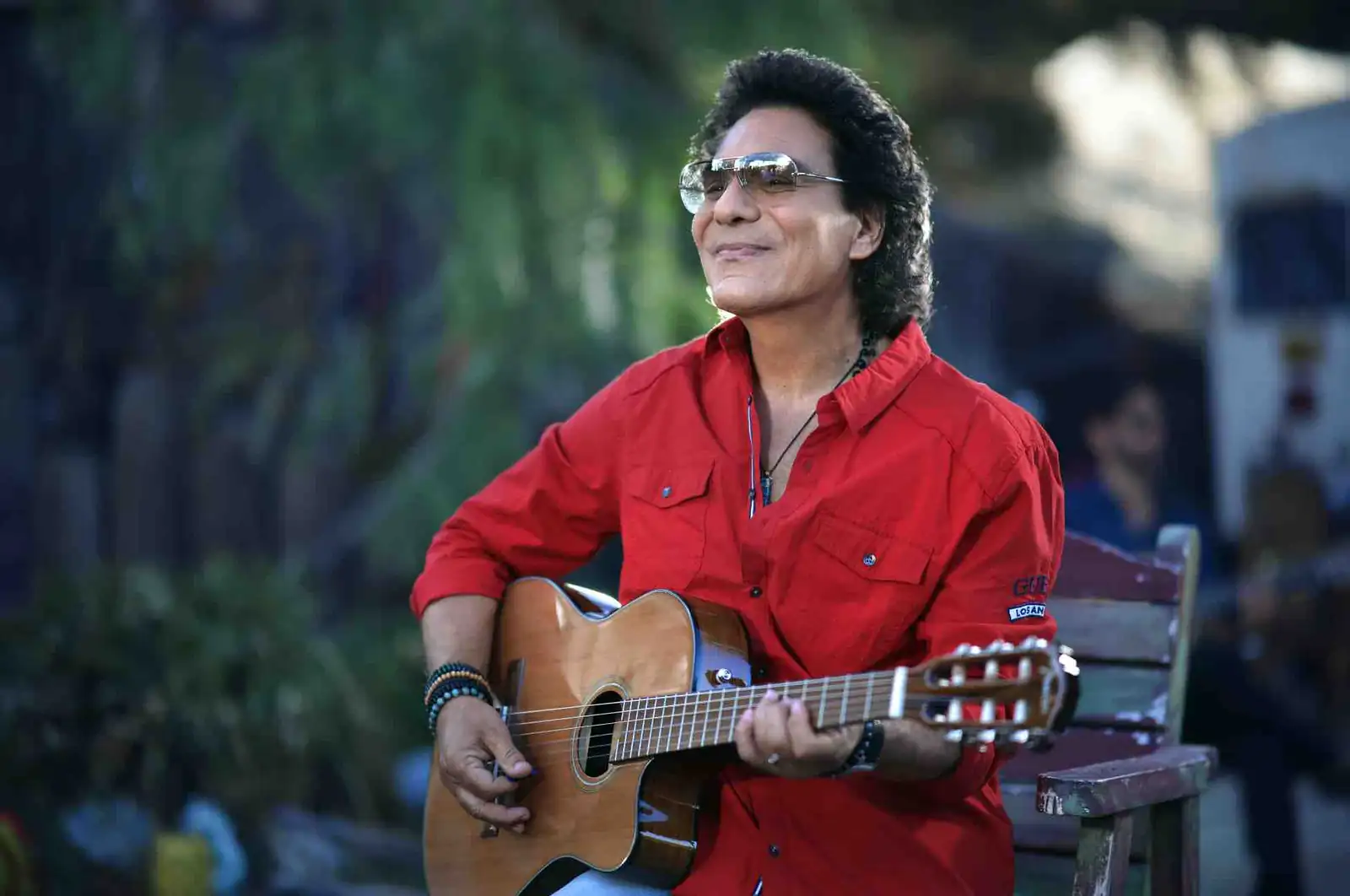 Andy Madadian singing during a live performance