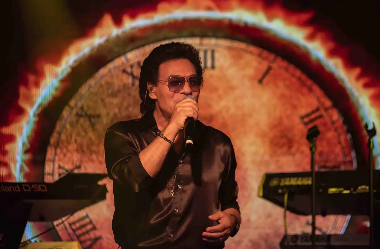 Andy Madadian on stage during a live performance